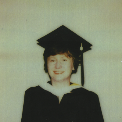 Young Linda Hughes in graduation attire