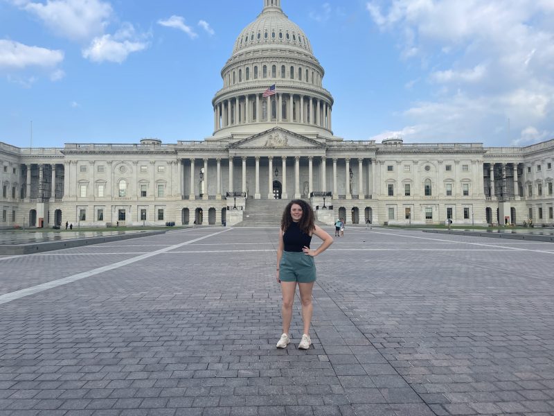 Korryn Penner is standing in front of the Washington D.C capital.