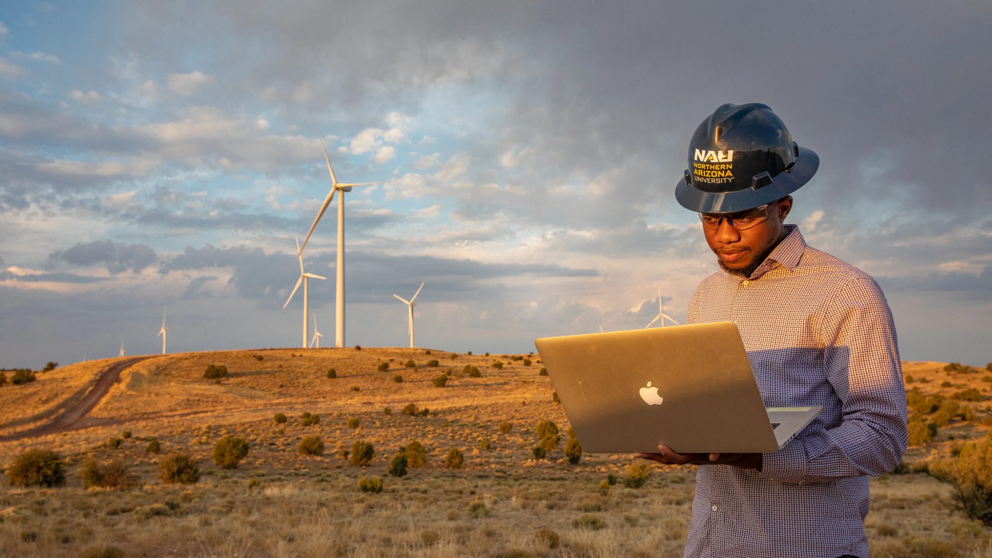 NAU student on site at a windmill farm.