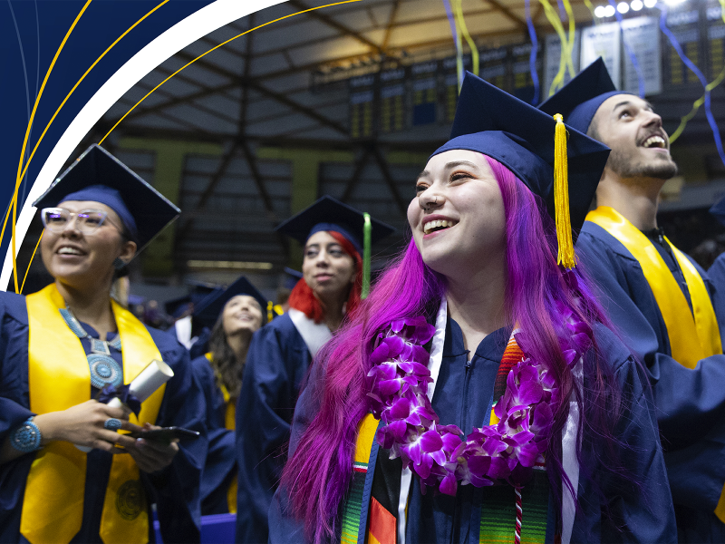 Graduates smiling during Spring Commencement