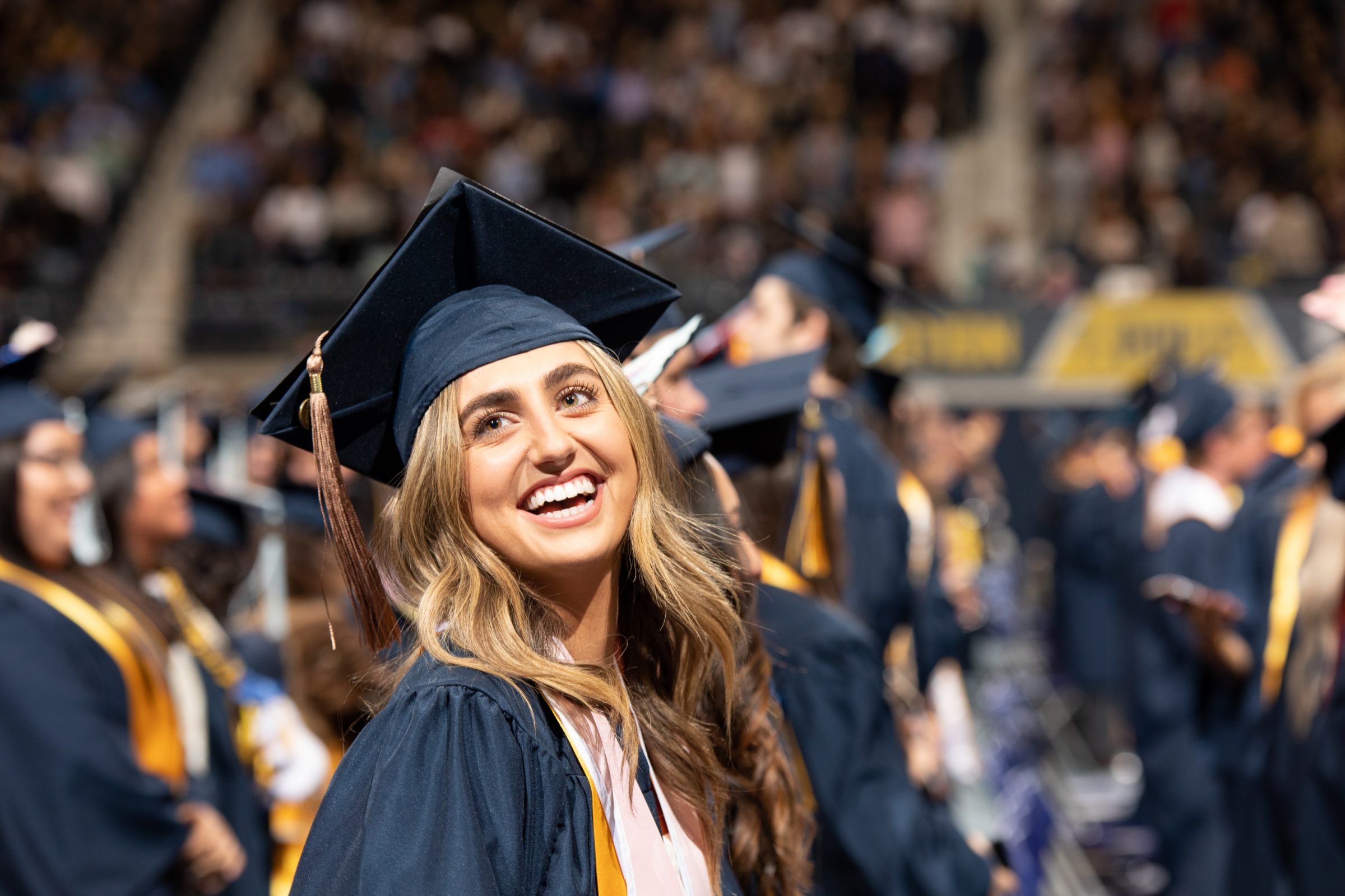 Female graduate smiling during ceremony