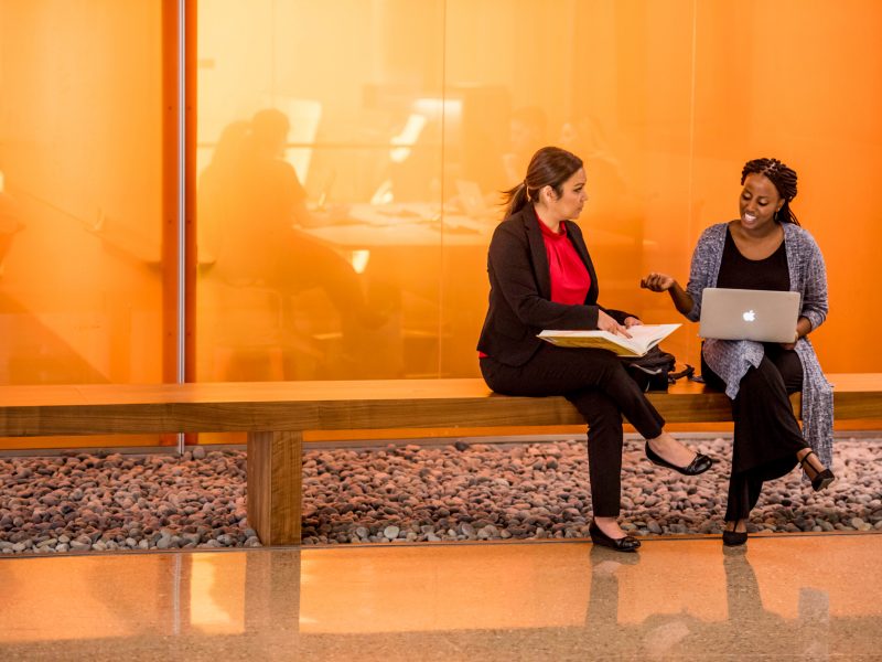 Students sit outside of the Phoenix Bioscience Core center.