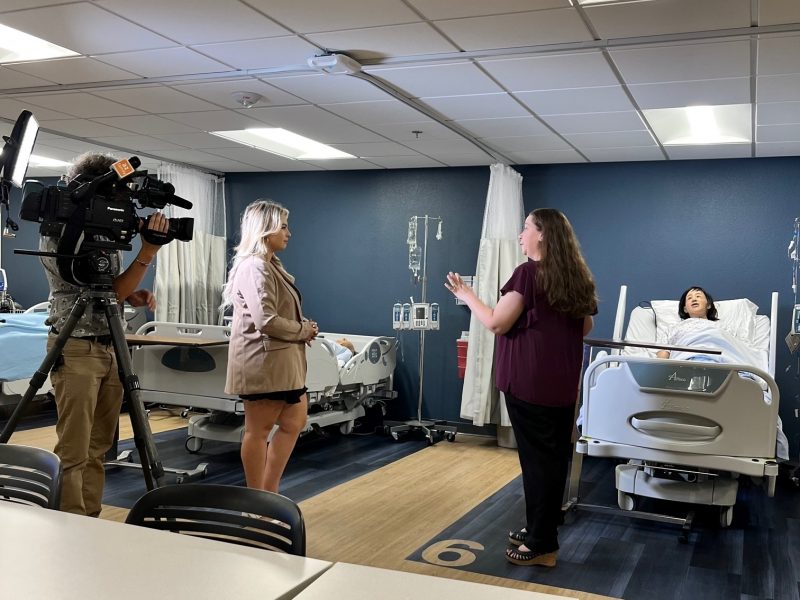 A news anchor interviews a NAU nursing teacher.