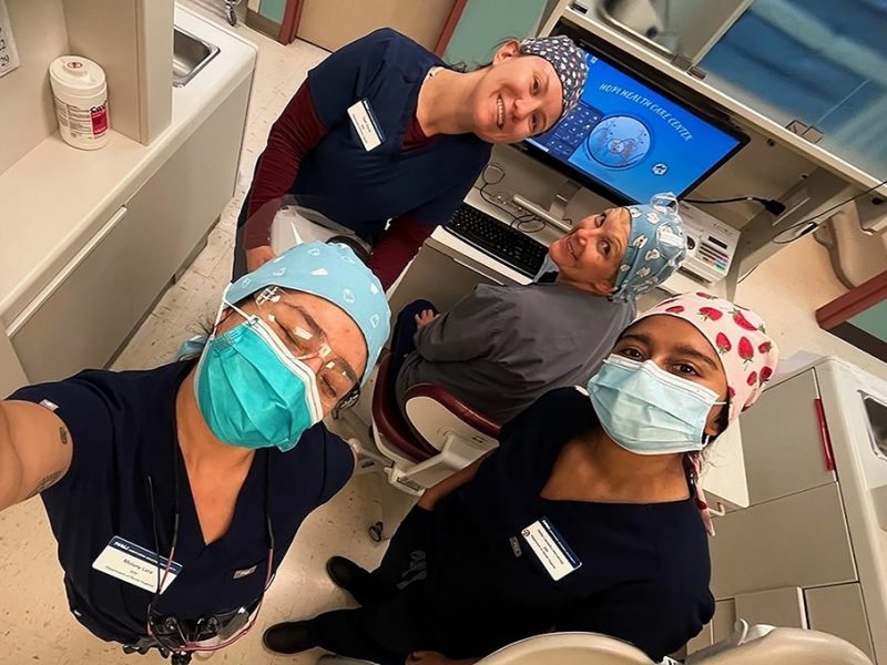 A group of dental hygienists smiling for the camera.