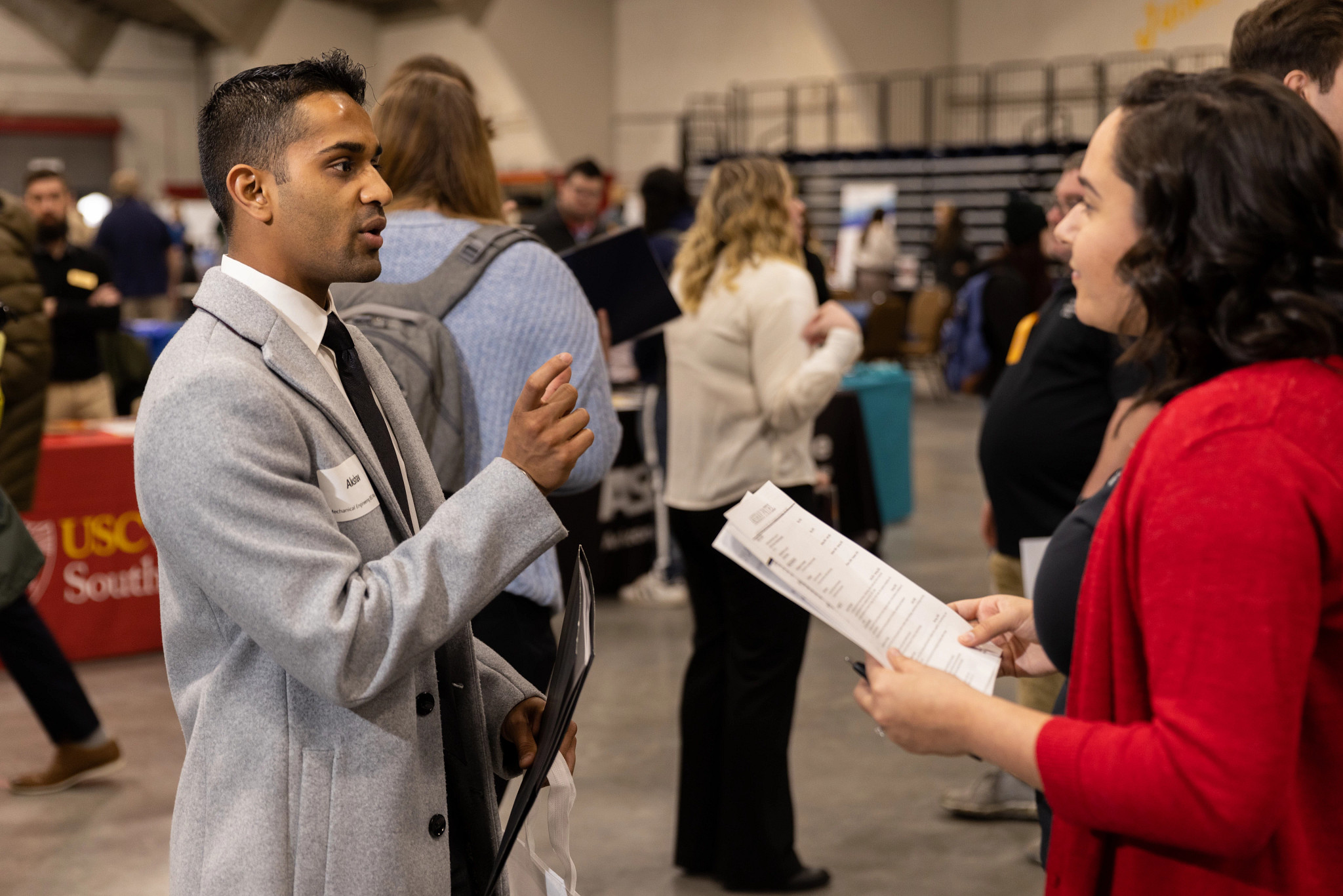 Student speaking with a recruiter.