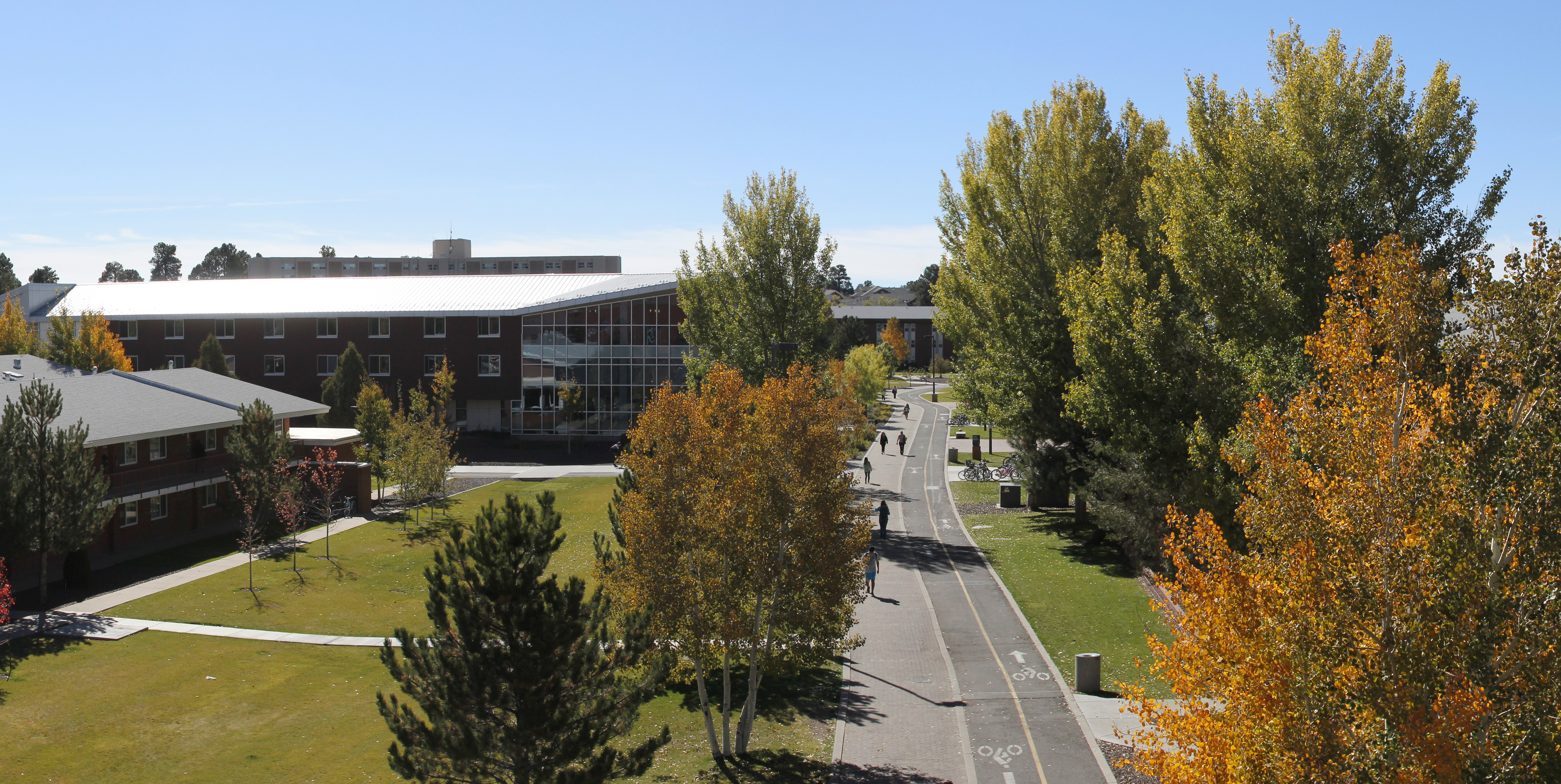 Flagstaff campus in the fall, with orange and green trees.