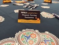 An Image of a card with the words NAU is proud to be a Hispanic Serving Institution