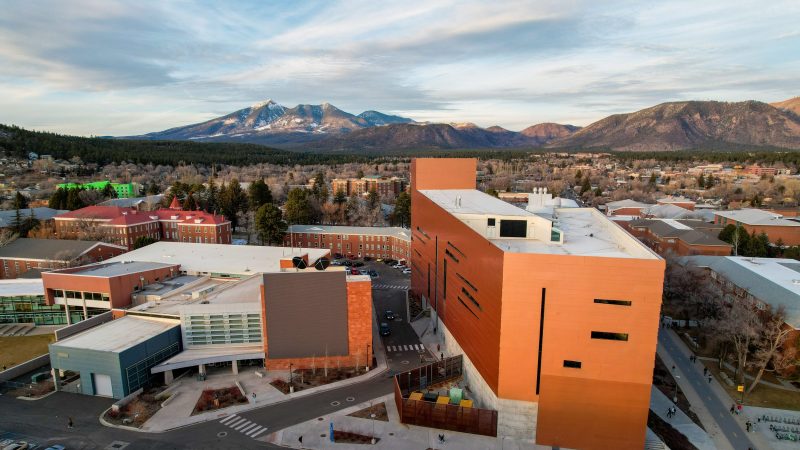 Overhead view of the Flagstaff campus with snowcapped mountains in the background.