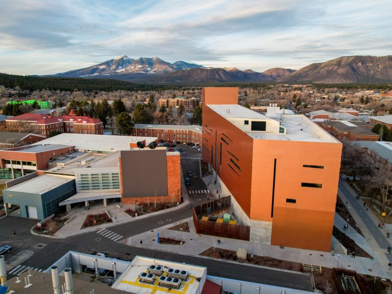 Overhead view of the Flagstaff campus with snowcapped mountains in the background.