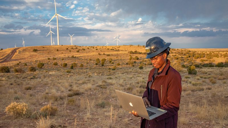 Student working at a wind farm.