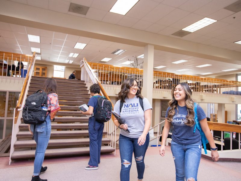 Students walk through the Yuma library.