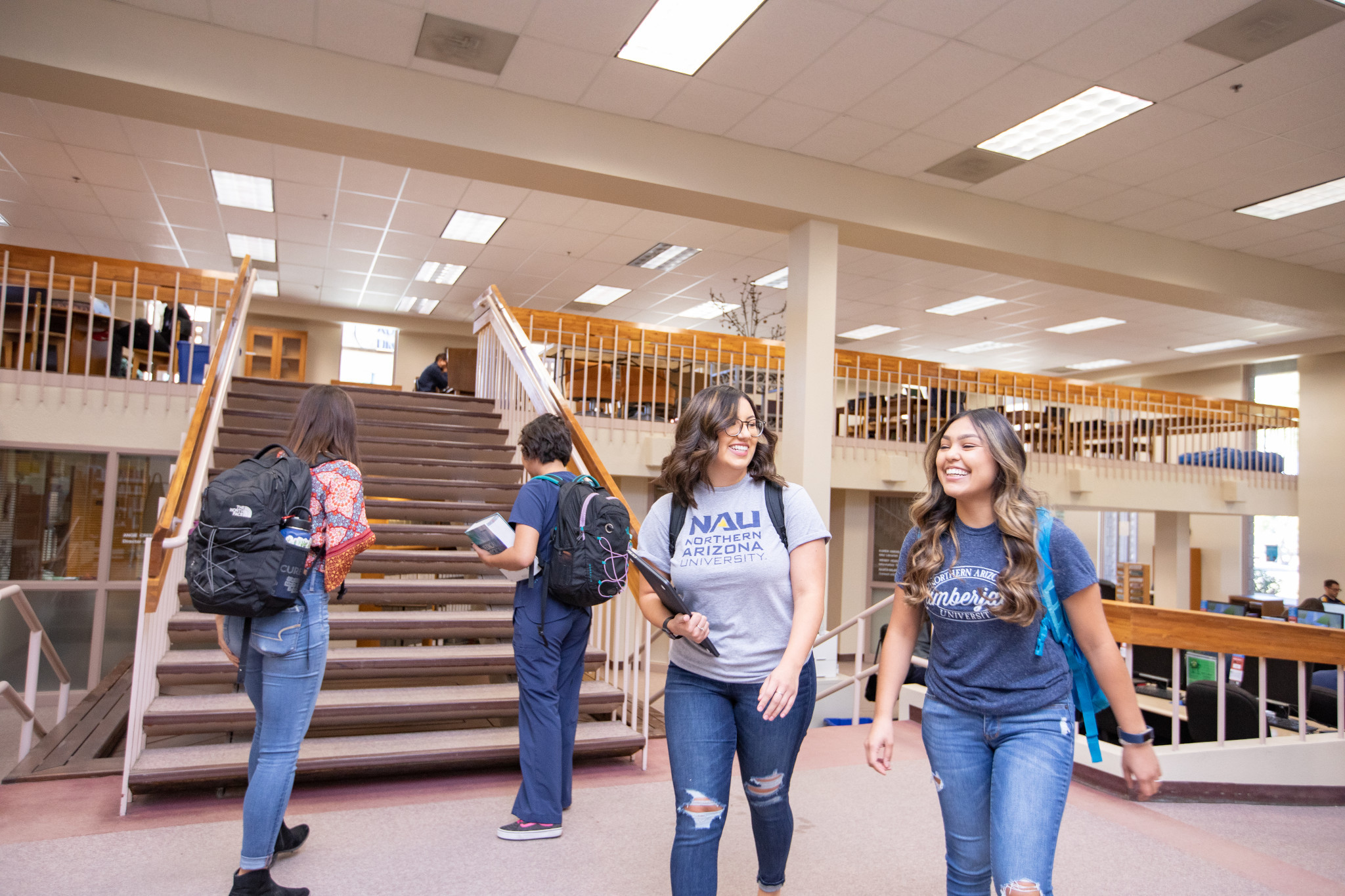 Students walk through the Yuma library.