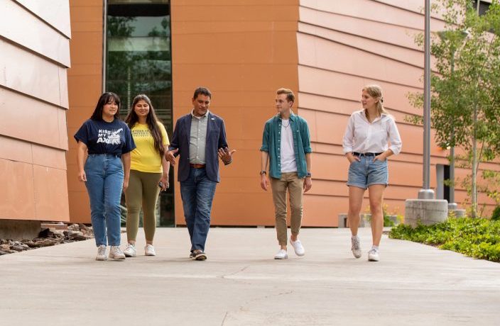 A photo of students walking on campus.