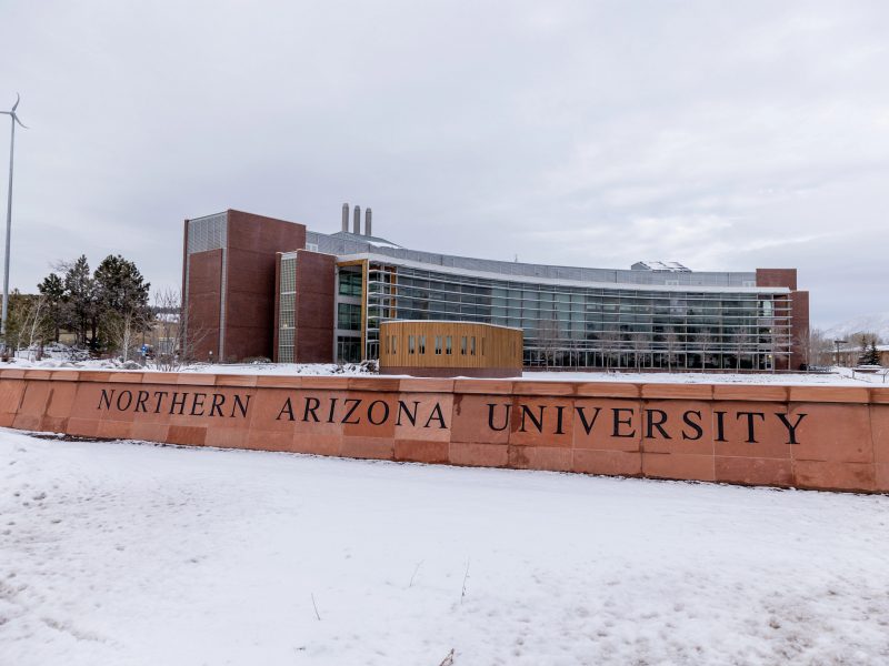 The south Northern Arizona University sign covered in snow