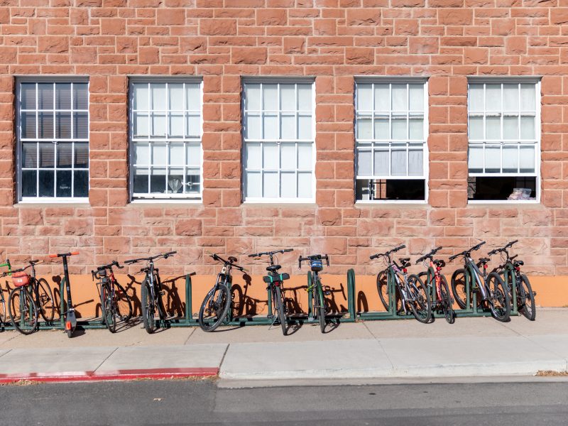 A bike rack on the side of a building at N A U's Flagstaff Mountain campus