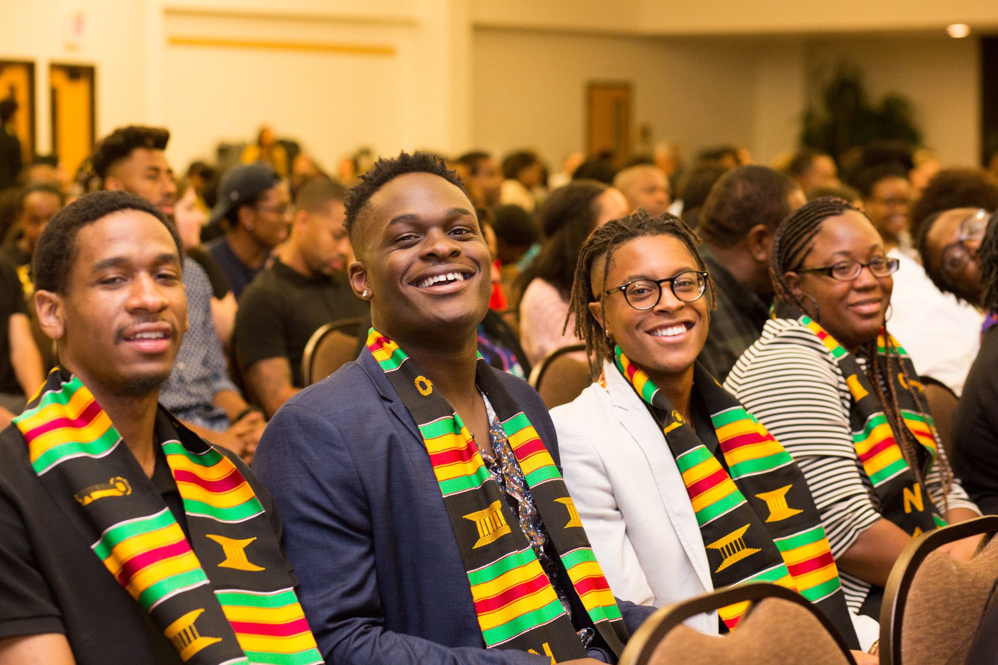 Students smiling at the black convocation.