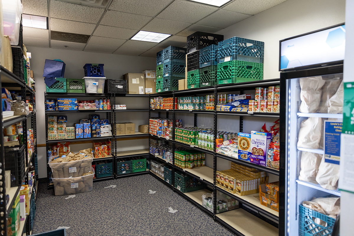 The Louie's Cupboard pantry is stocked with groceries on shelves.