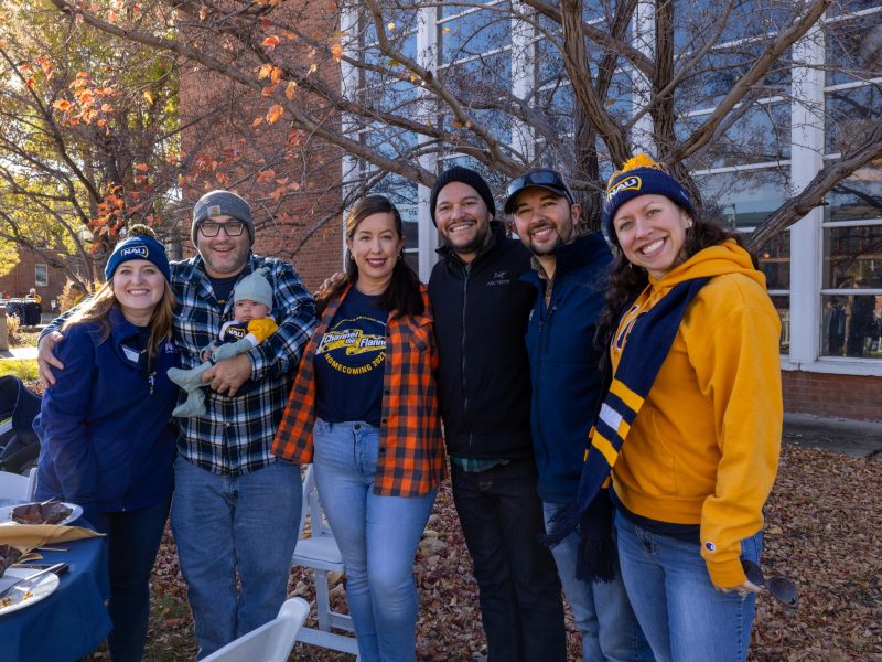 N.A.U. alumni pose for a photo.