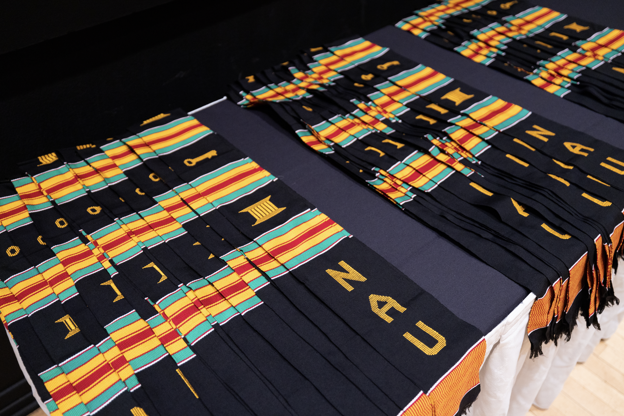 N A U Kente cloth stoles during during the Black Convocation ceremony.