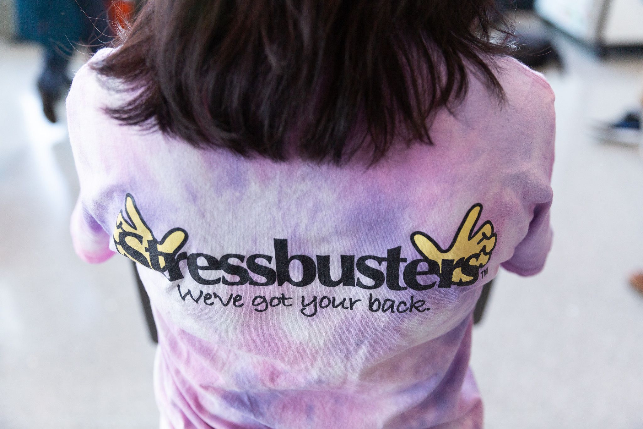 A student poses in a stressbusters tshirt