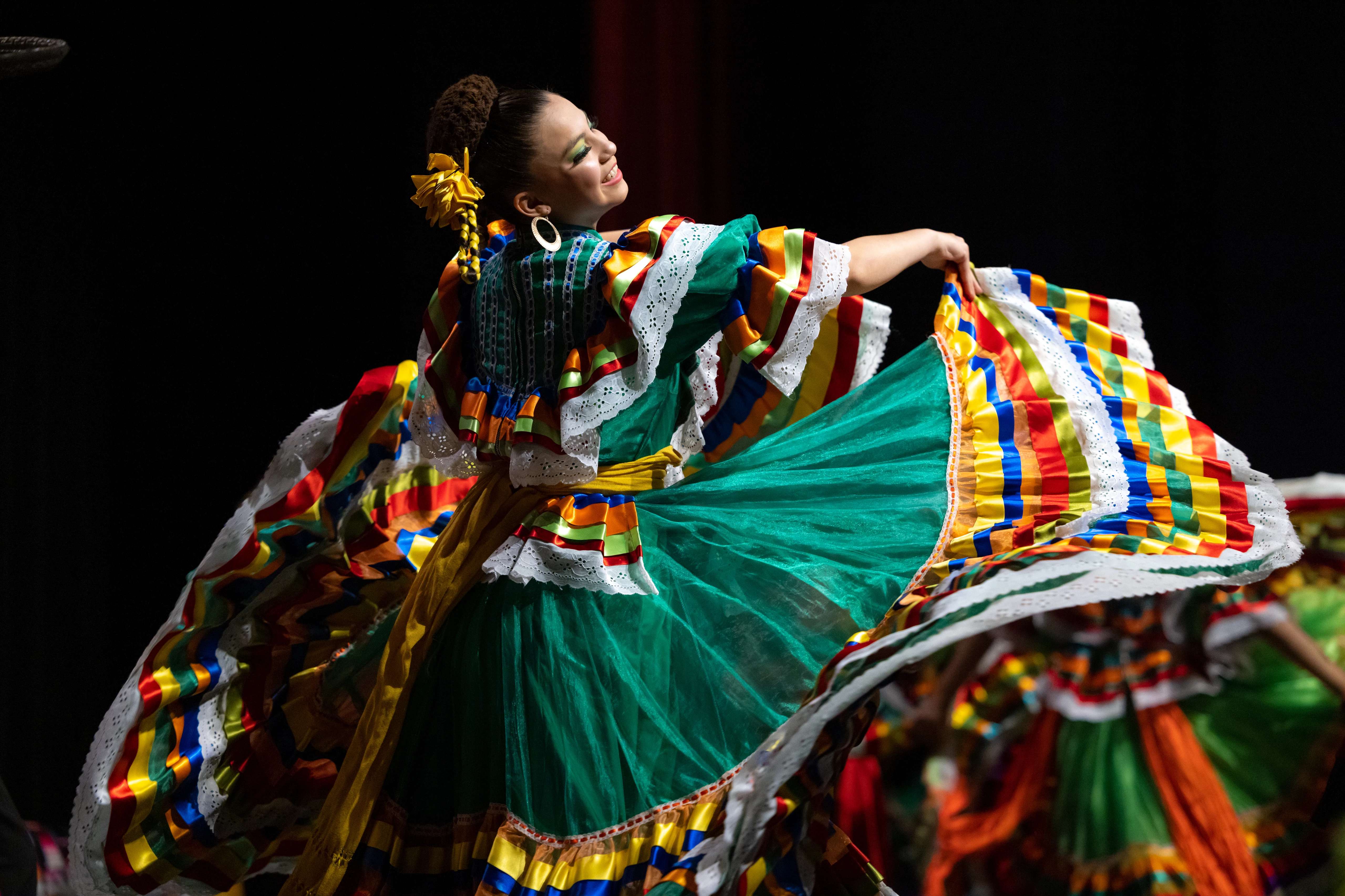 A student performs a dance at the Hispanic Convocation