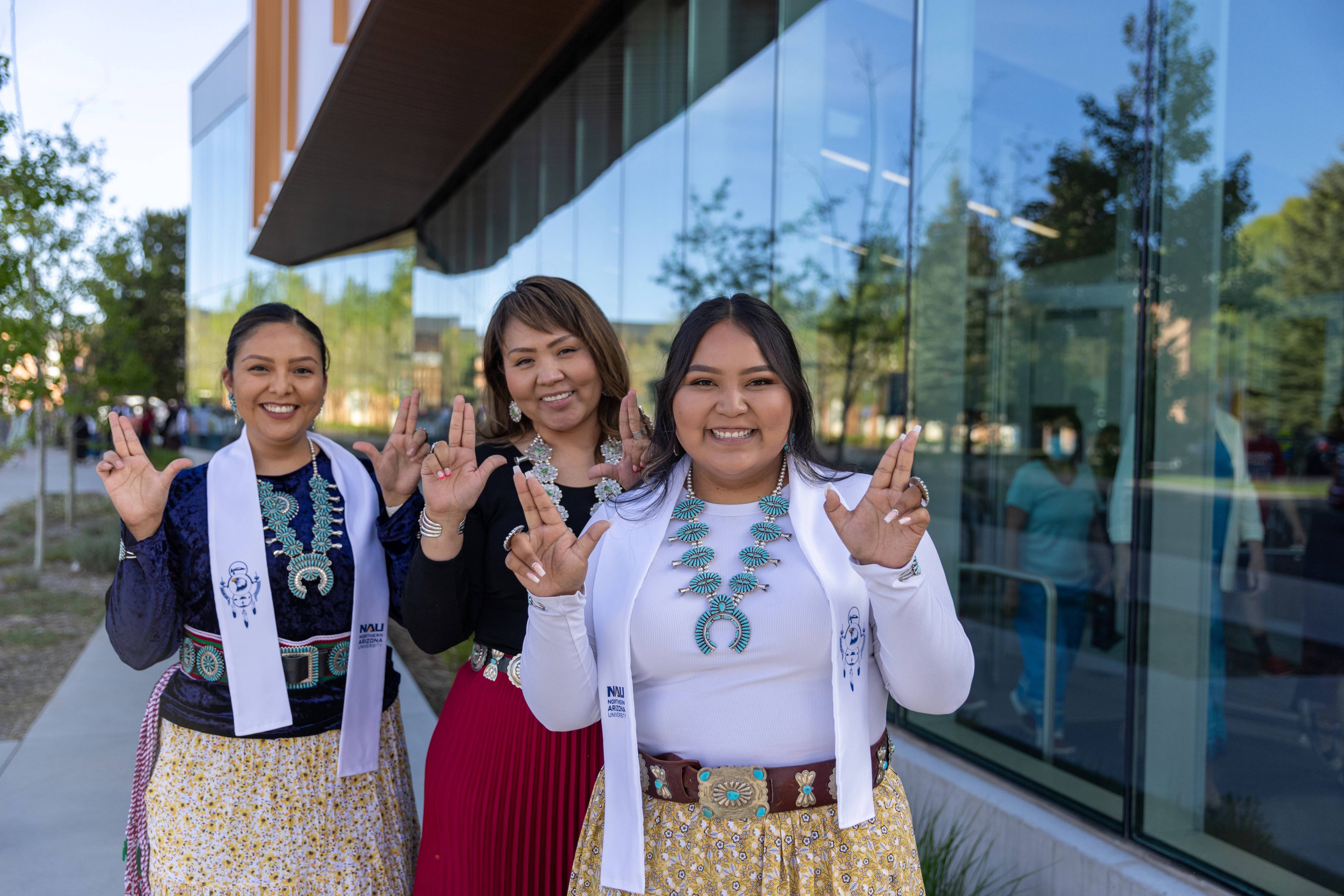 Indigenous students smiling and posing during the Indigenous convocation reception