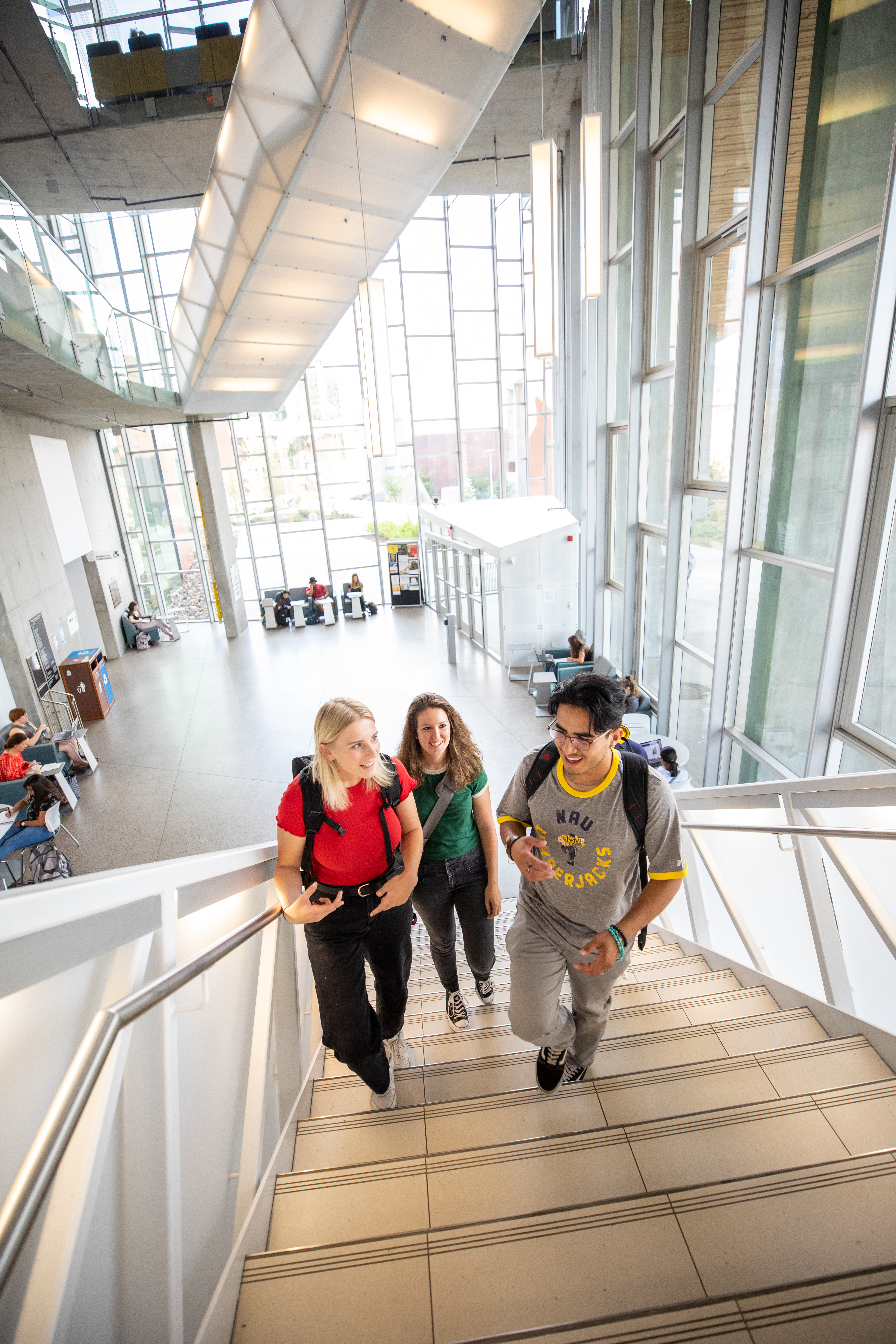 A photo of students walking up the stairs.