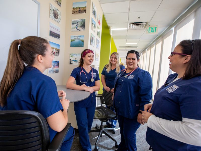 Nursing students talking at the Yuma campus.