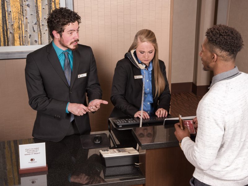 NAU students work at the Double Tree Hotel front desk.