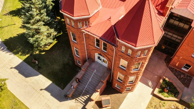 Drone shot of the Old Main building during mid day.