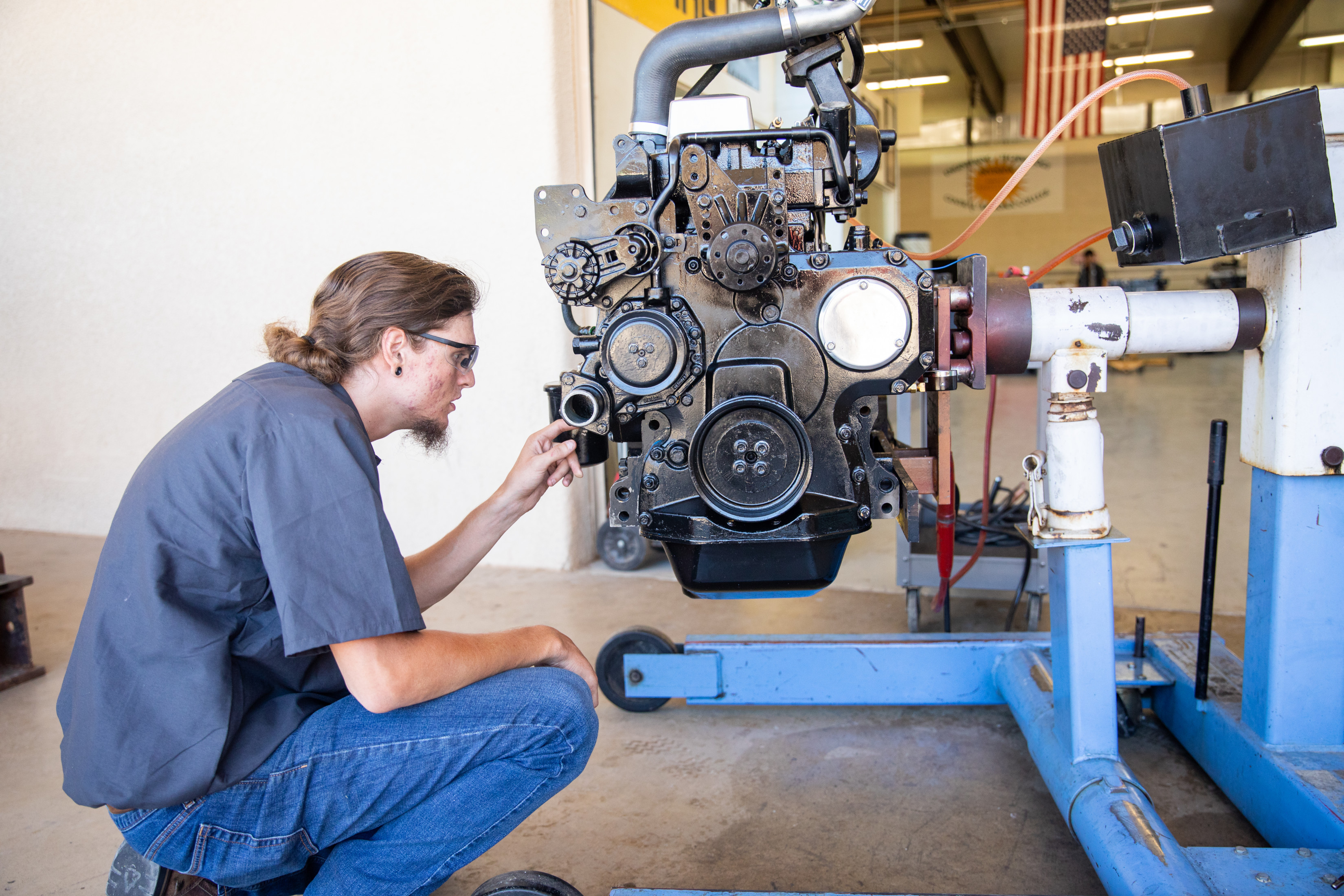 A man working on a car engine.