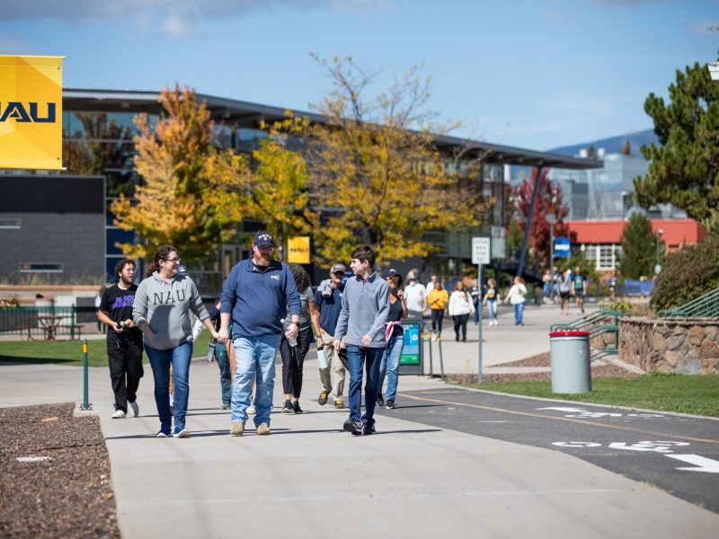 Families walking near the Student Union for Family weekend at Northern Arizona University.