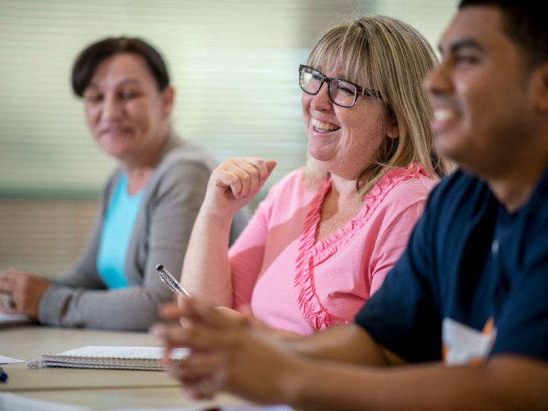 Adult students listening to a lecture.