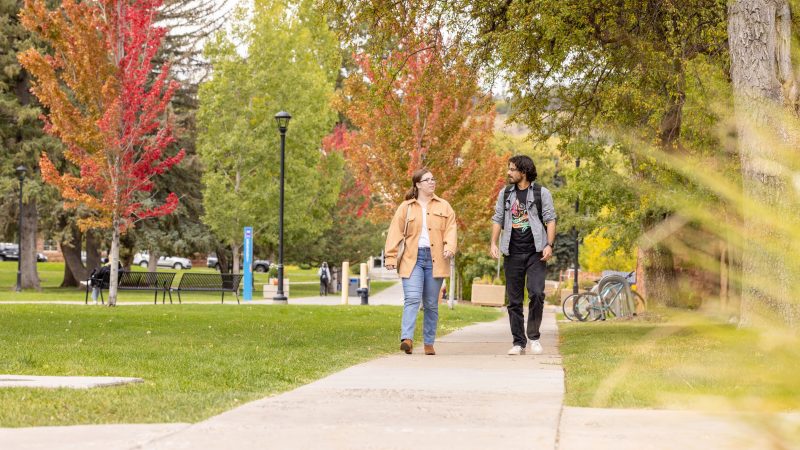 Two N A U students walking on campus.