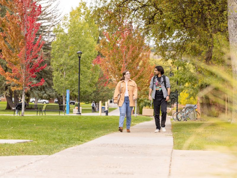 Two N A U students walking on campus.