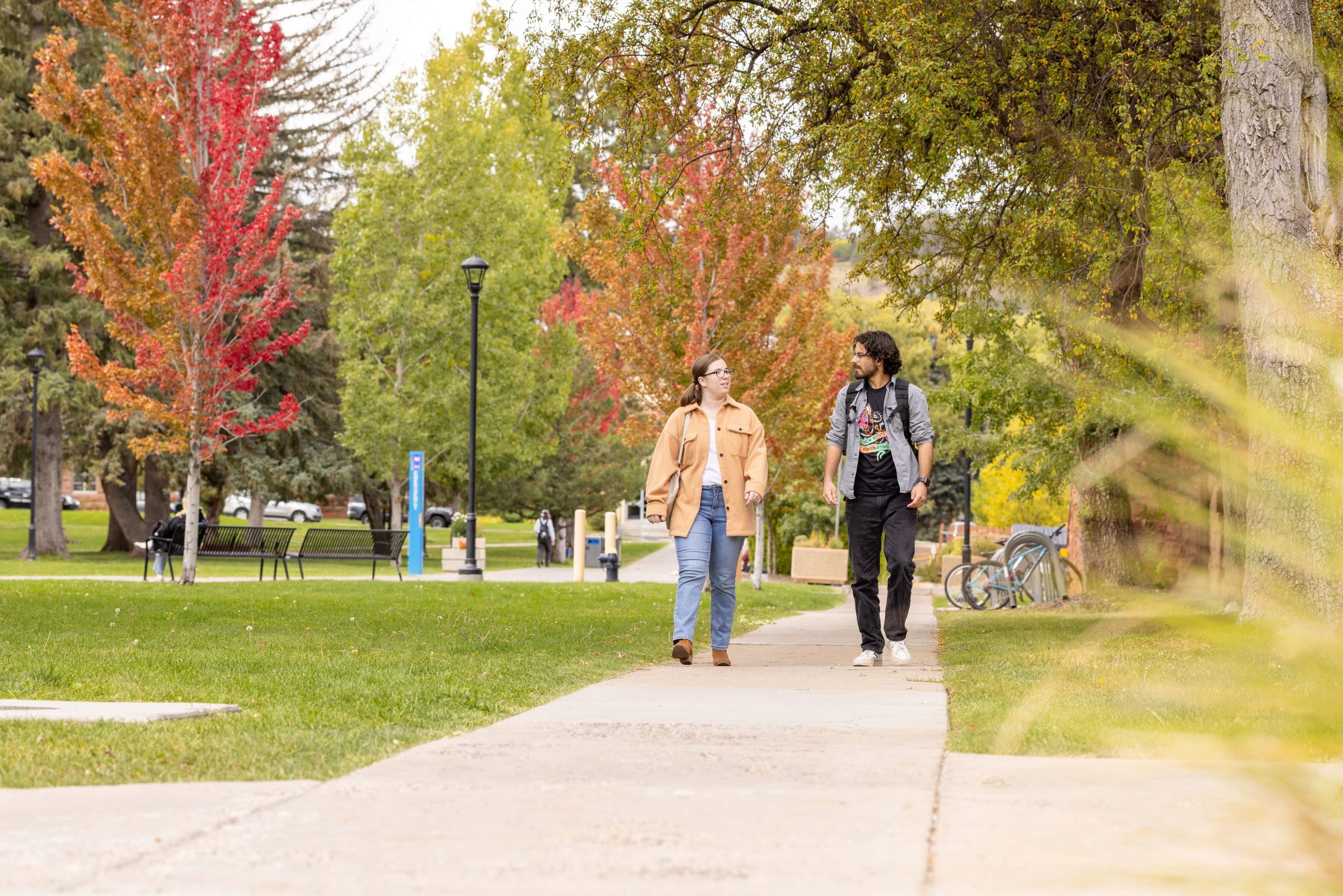 Two N A U students walking on campus.