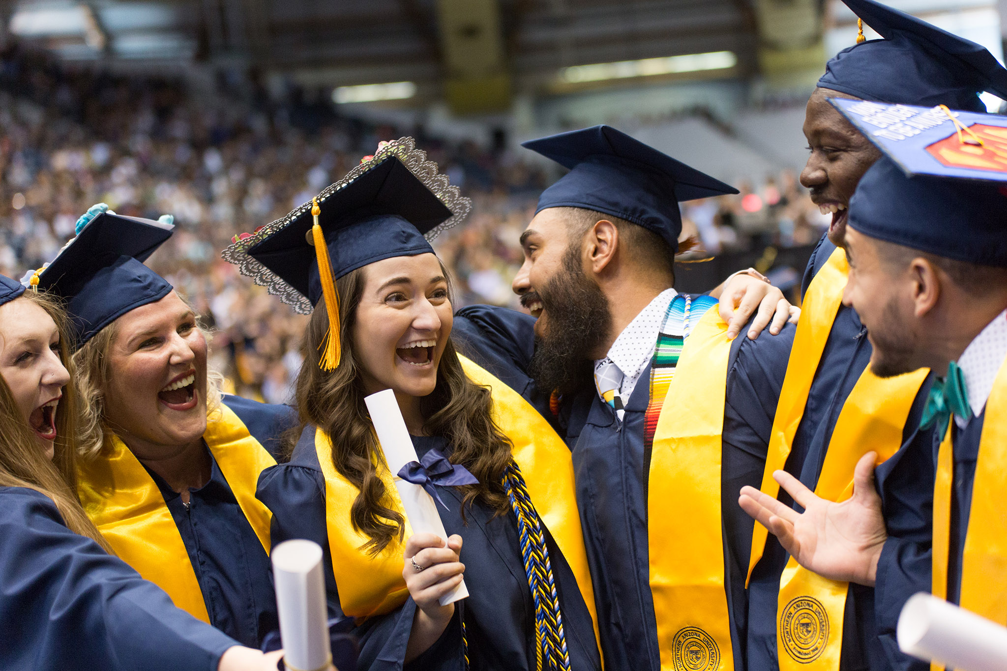 N A U College of Health and Human Services students smile at commencement.