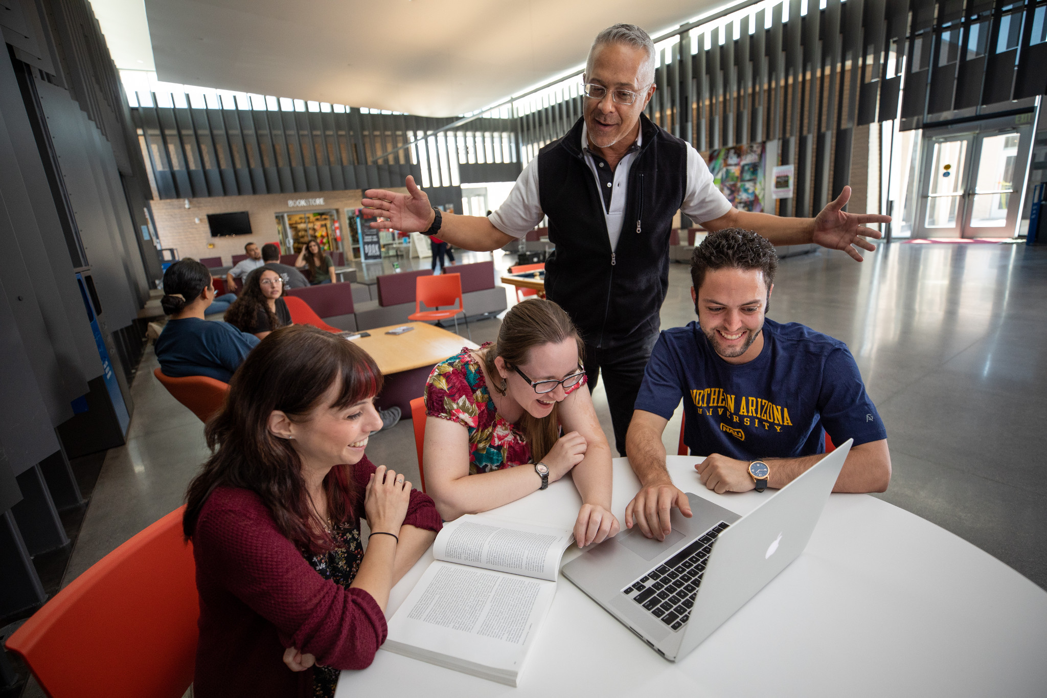 NAU students on a desk working together.