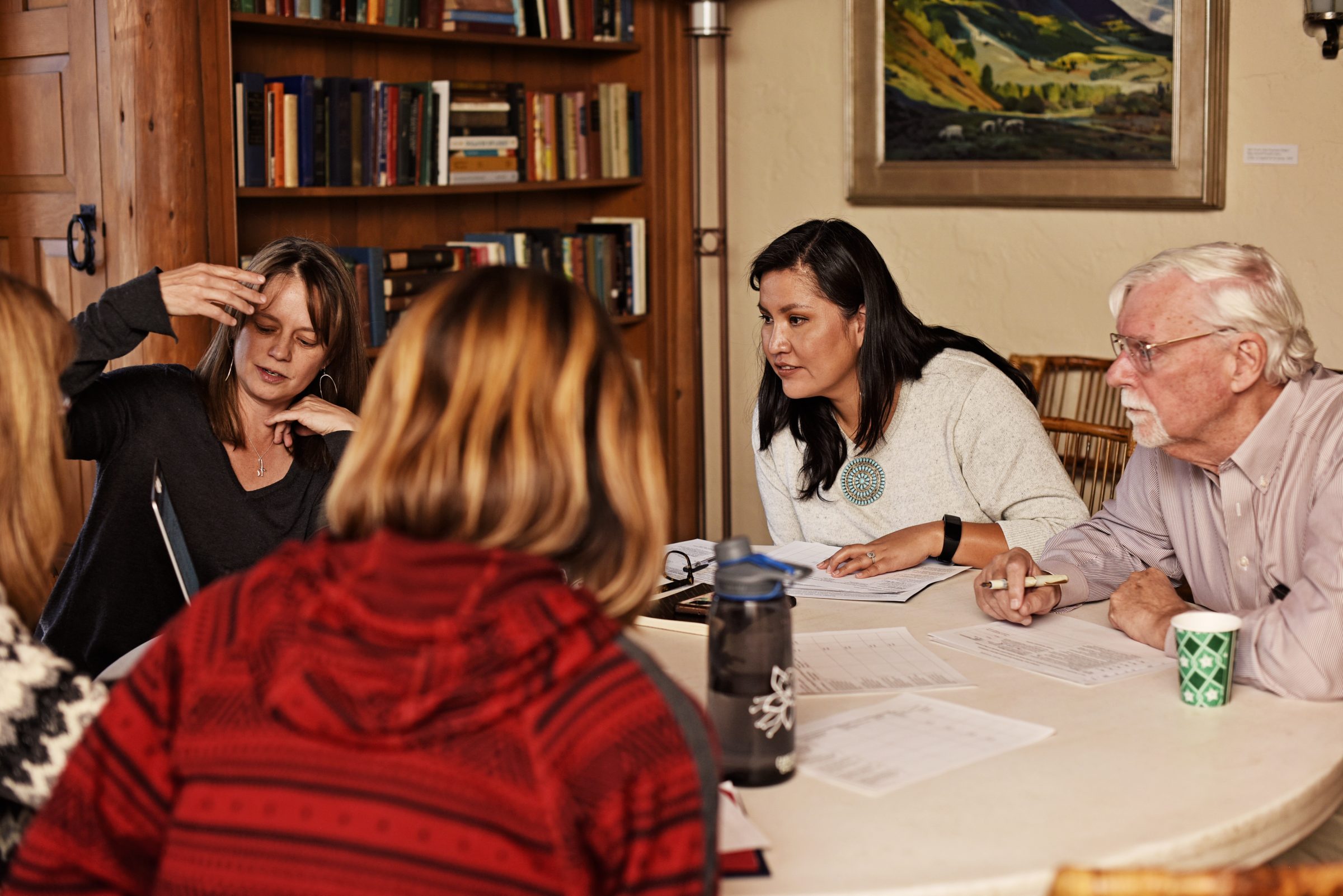 Heather Williamson, Carmenlita Chief, and Robert T. Trotter II work on a project during a center retreat.