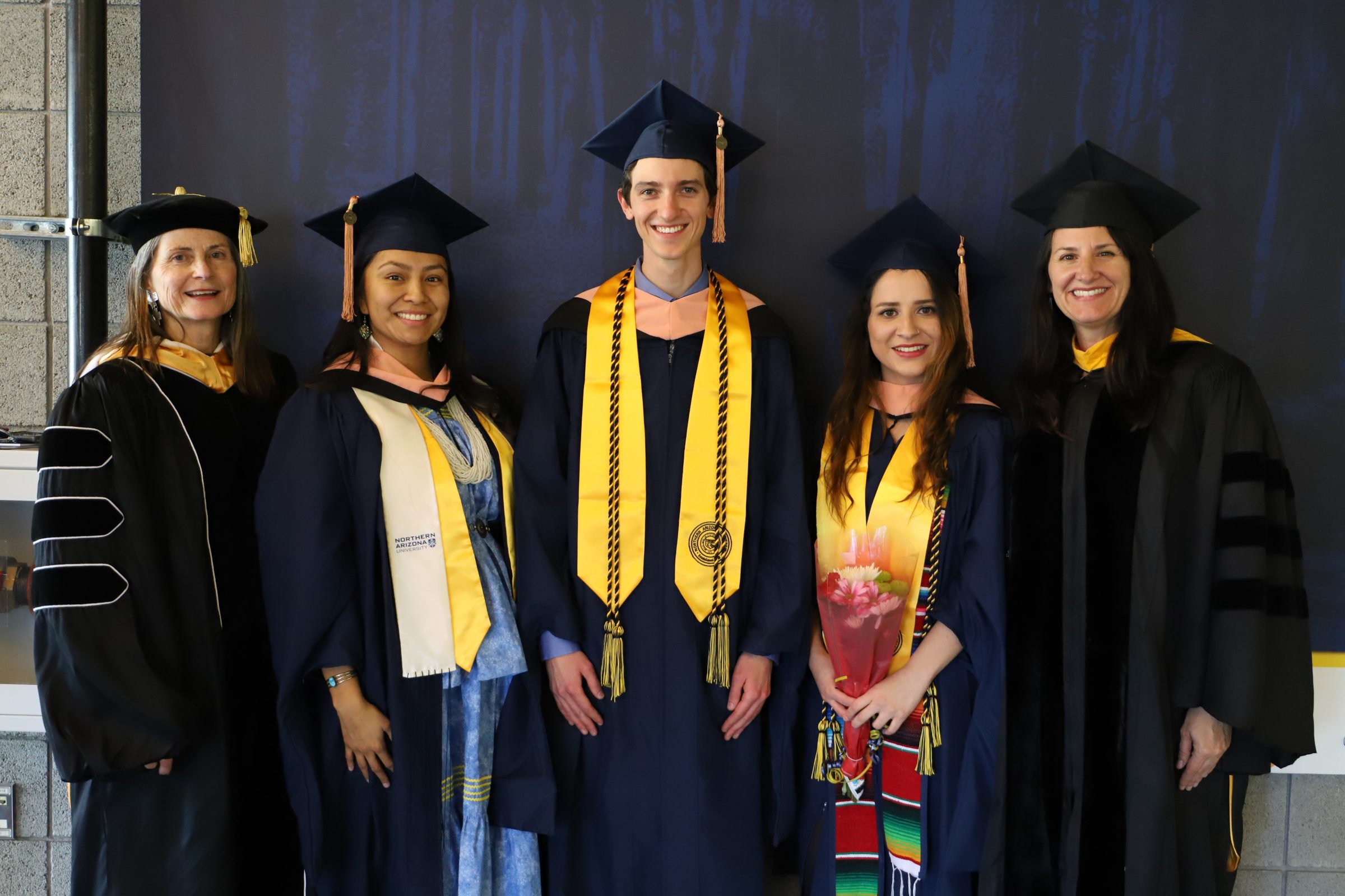 Nicolette Teufel-Shone, Marissa Tutt, Grant Sears, Dulce Jimènez, and Samantha Sabo in a group shot at graduation.