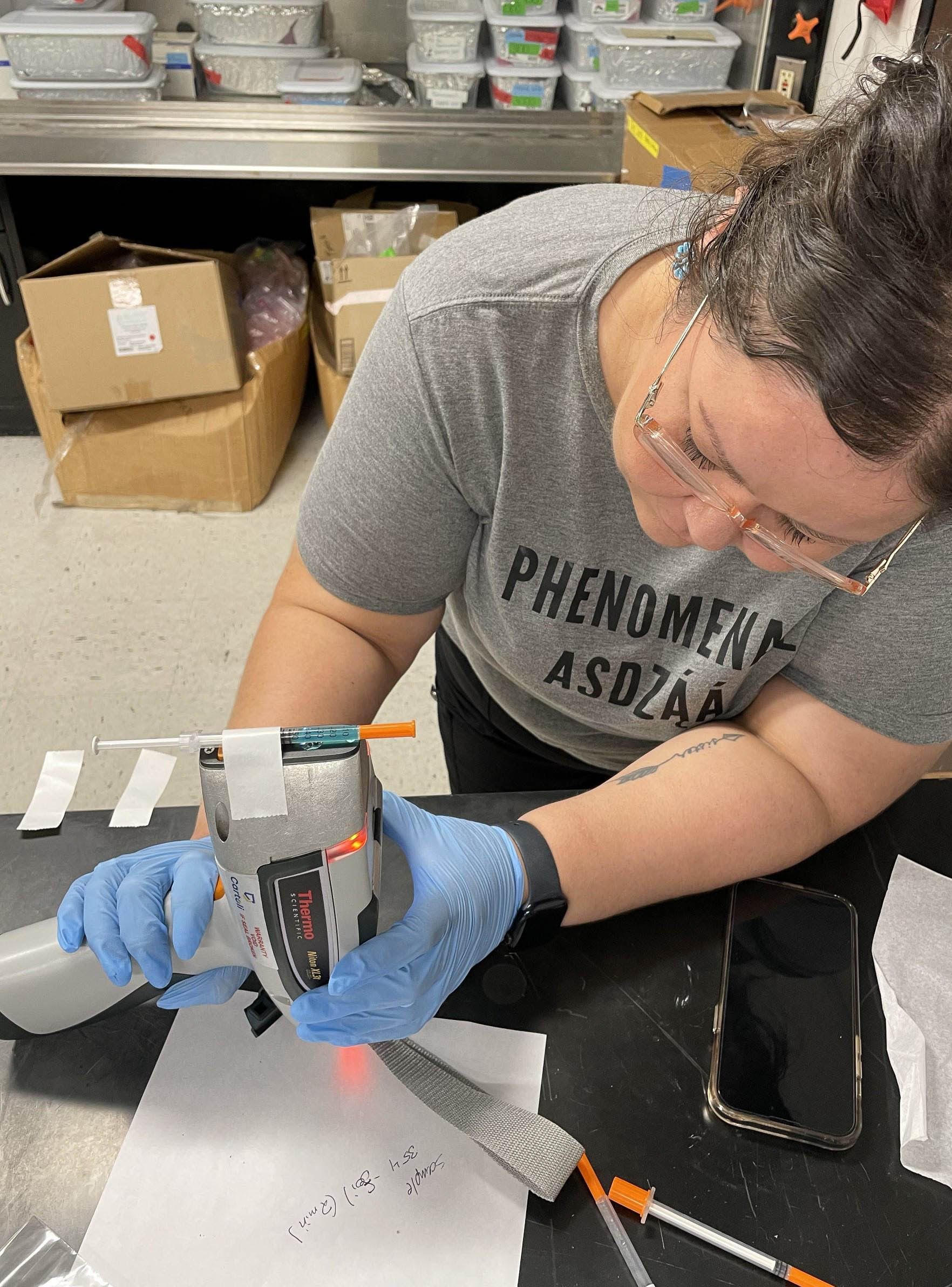 Goodluck operates a portable x-ray fluorescence device at the University of Mississippi.