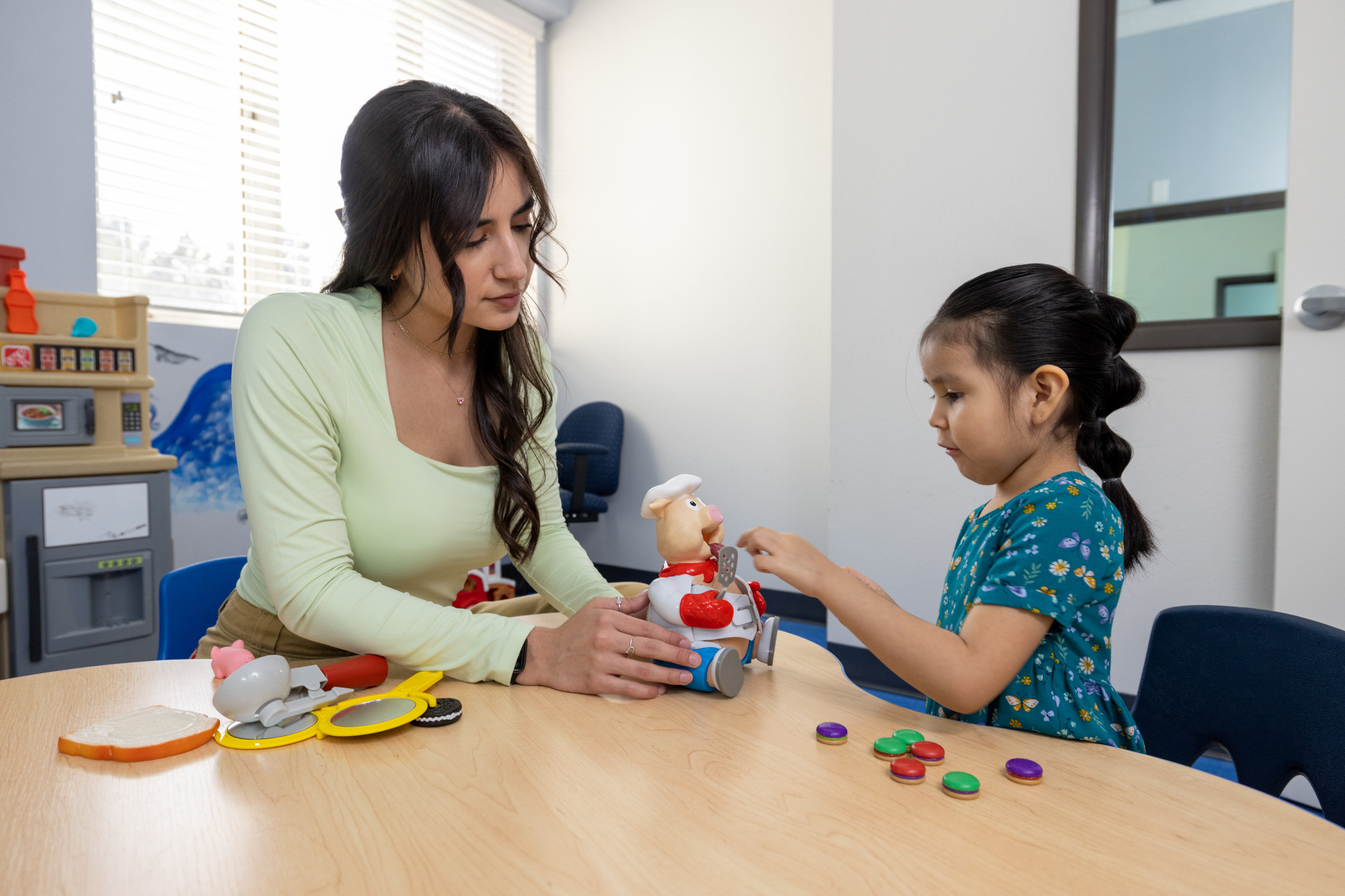 Women doing a skills test with a child.