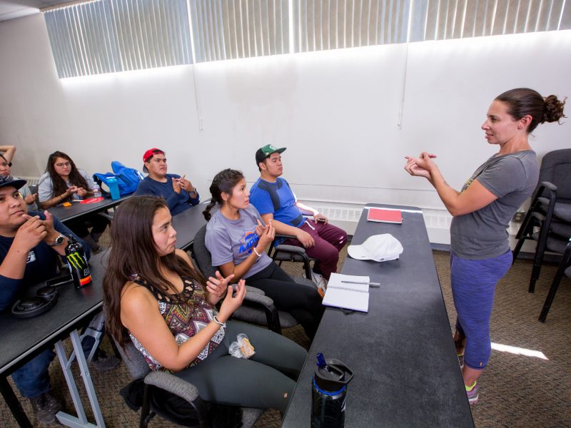 Students sitting in a classroom at Dine College.