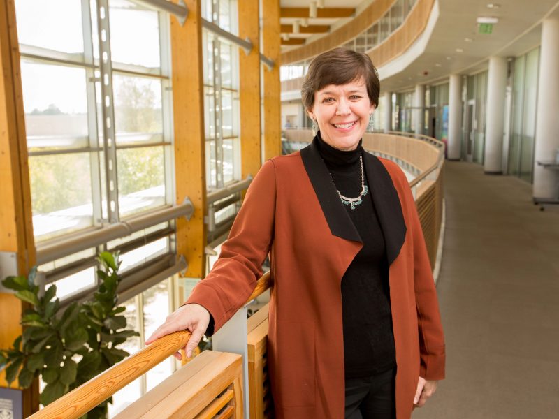 Julie Baldwin standing in Graduate Research facility.