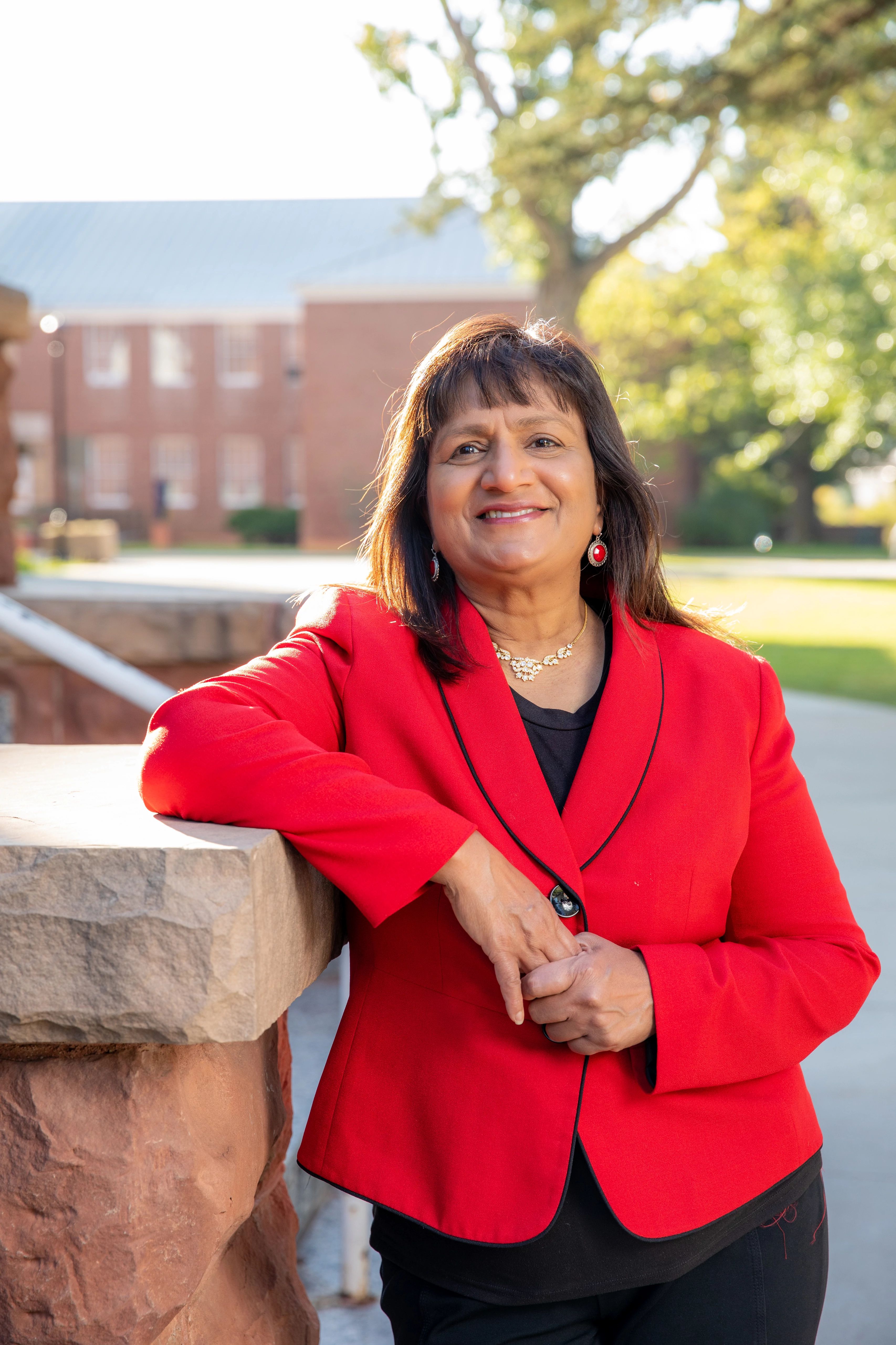 Ramona Mellott standing outside leaning on a wall.