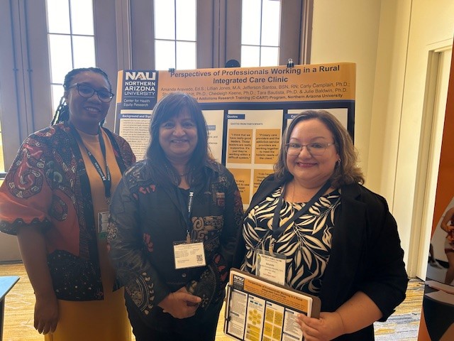 Lillian Jones (left) and Amanda Acevedo (right) stand with professor Ramona Mellott at their poster presentation at the AzPA conference.