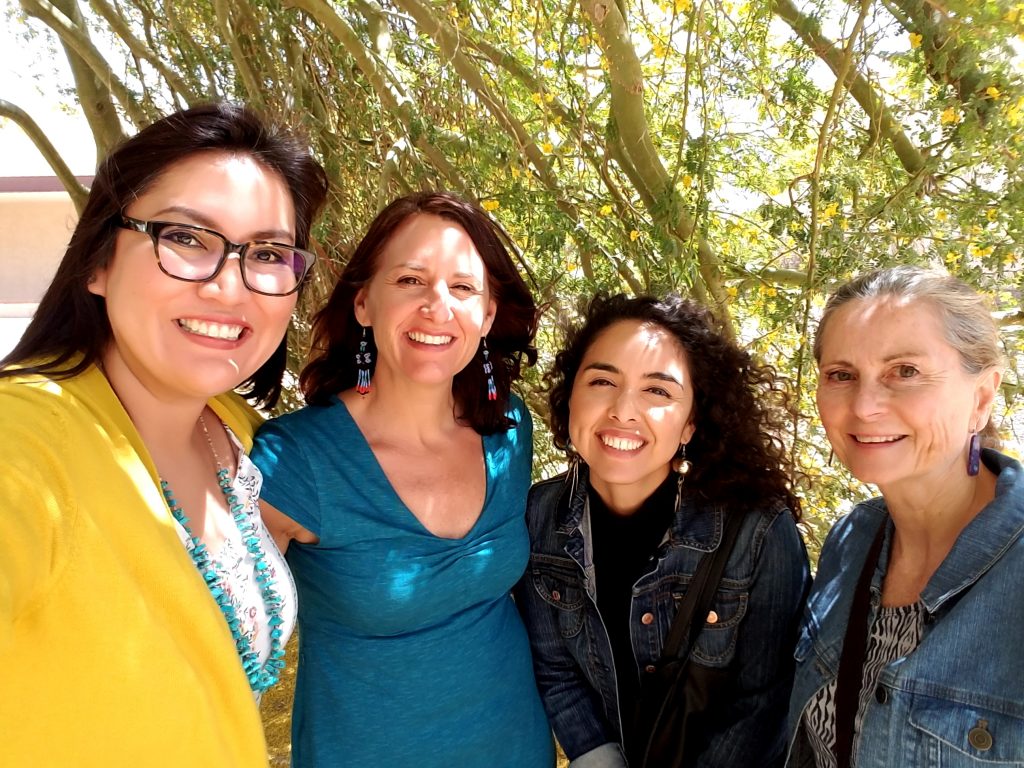 Carmenlita Chief, Samantha Sabo, Alexandra Samarron Longorio and Nicolette Teufel-Shone join together for a photo during a meeting.