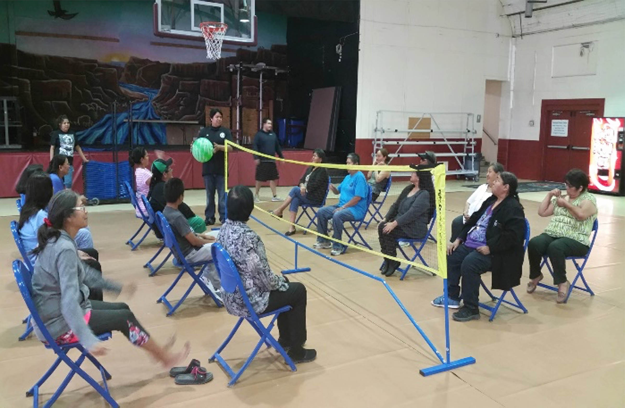 Community members gather to play chair volleyball at the Fitness Center.