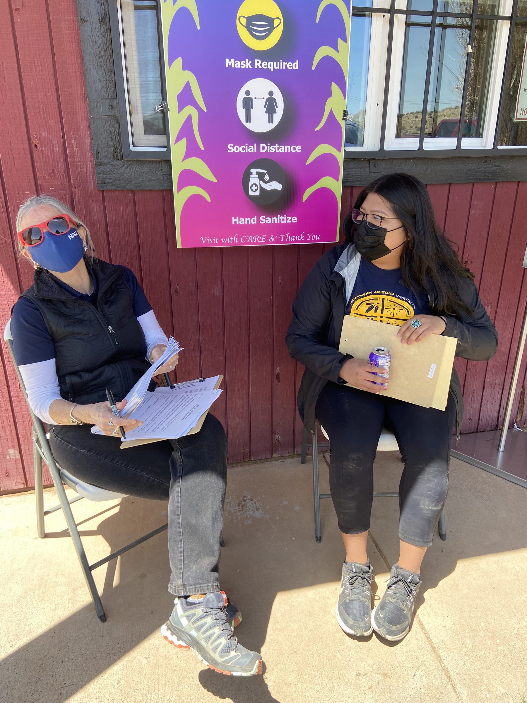 Nicolette Teufel-Shone sitting outside with a person.