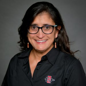 Guadalupe X. Ayala, PhD, MPH portrait wearing a black shirt.